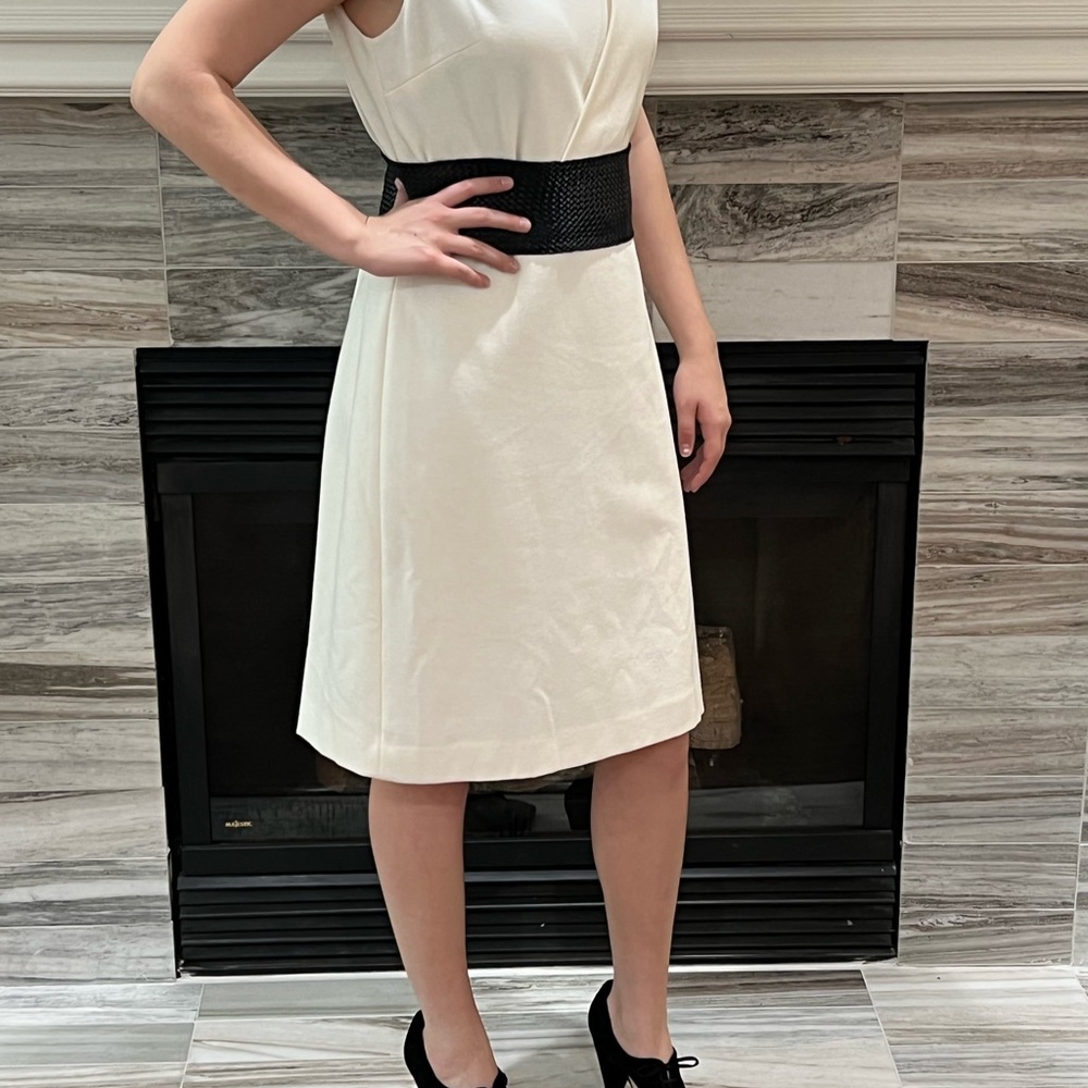 Winter white dress quite versatile to accessorize.